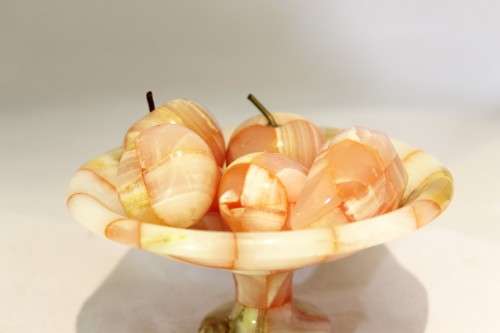 Marble fruit on a marble pedestal bowl