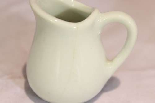 Four white jugs