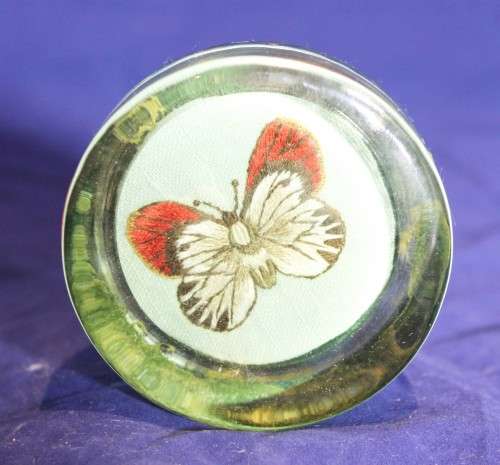 Glass paperweight with a butterfly