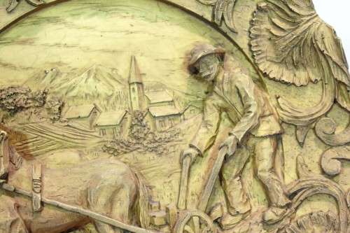 Carved wall hanging - European scene - ploughing
