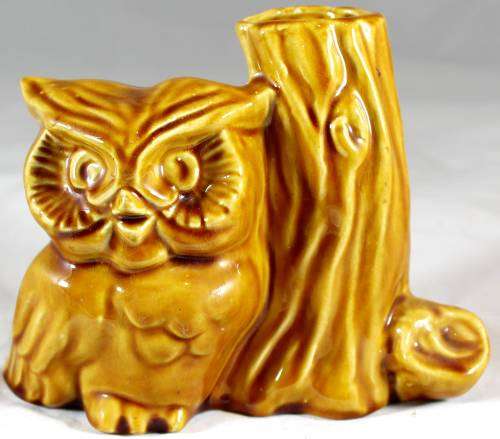 Brown Owl with hollow Tree Stump