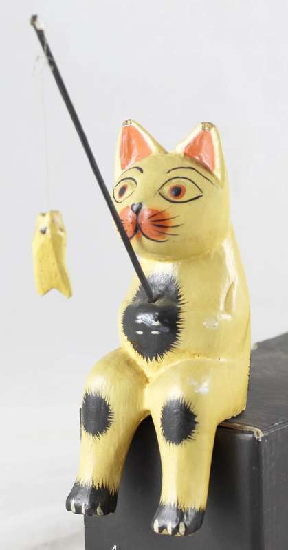 Brown cat fishing