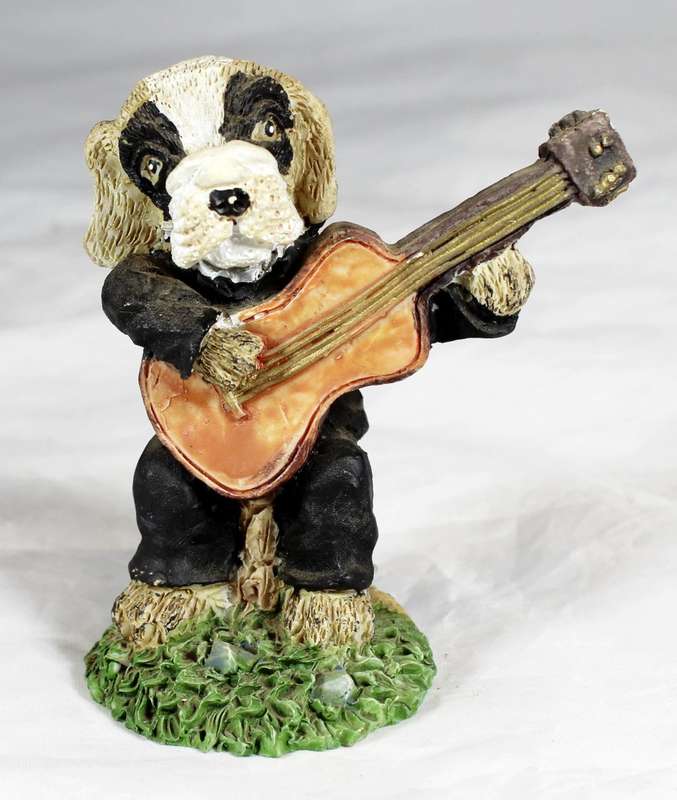 Dog playing a guitar