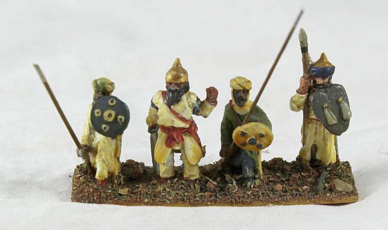 Lead figurine - four Eastern foot soldiers