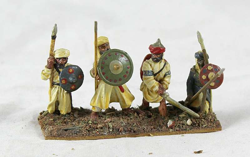 Lead figurine - four Eastern foot soldiers