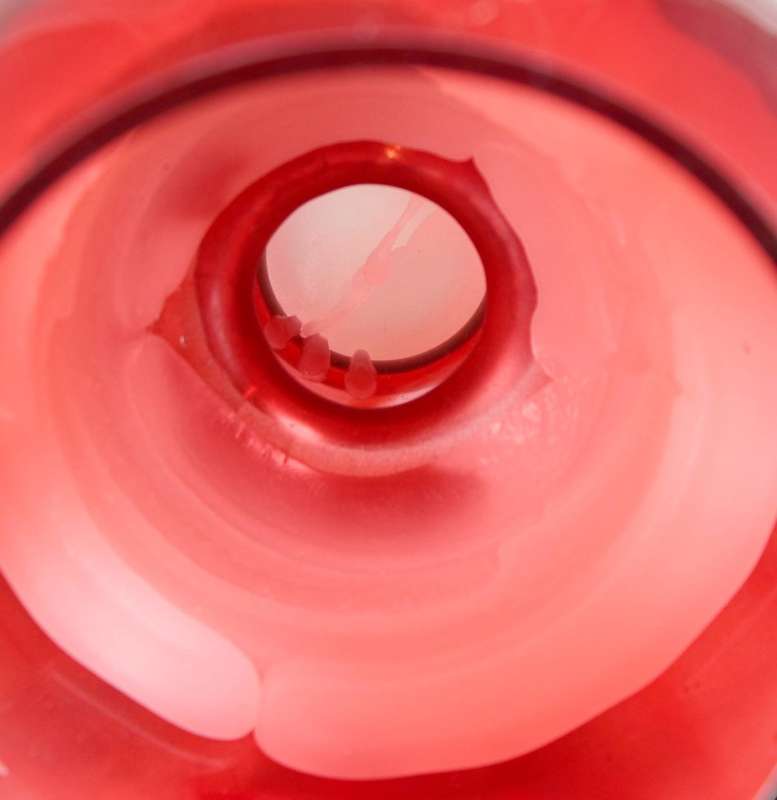 Red glass - stemmed bulbous candle holder
