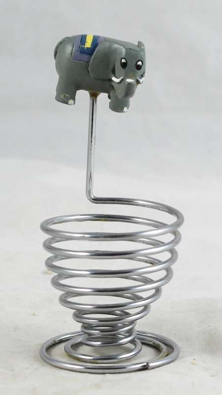 Egg holder with elephant charm