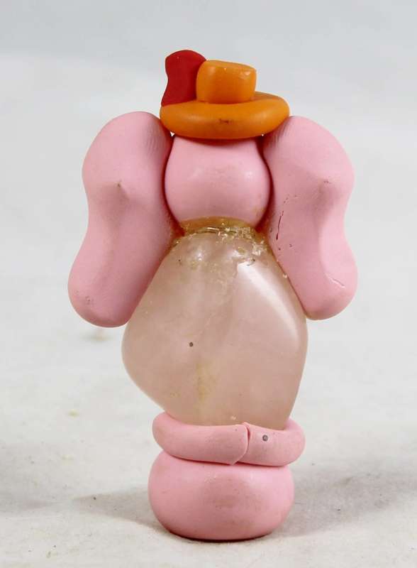 Top hat elephant mounted on a stone