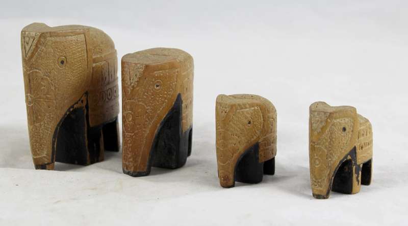 Carved wood elephants - family of four