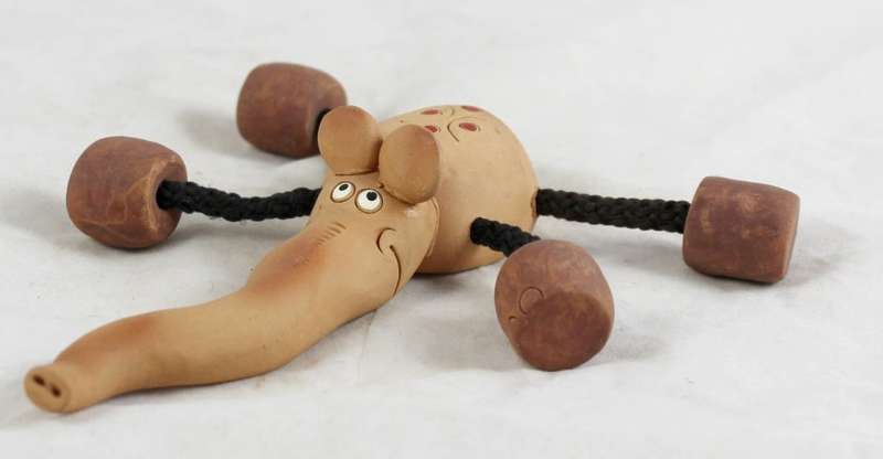 Clay elephant with rope legs