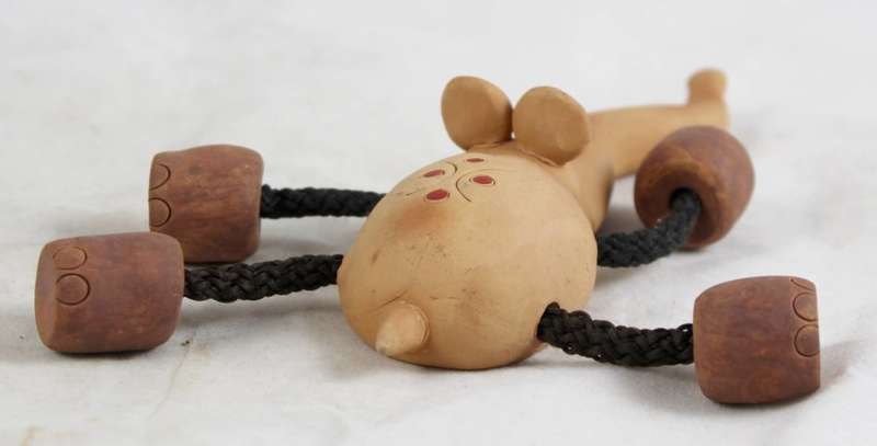 Clay elephant with rope legs