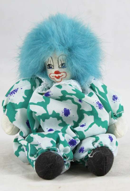 Clown with blue afro