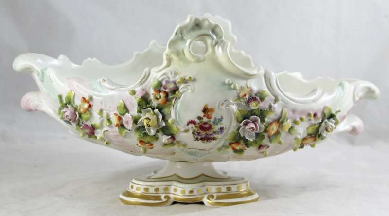 Very old center piece on stand - embossed flowers