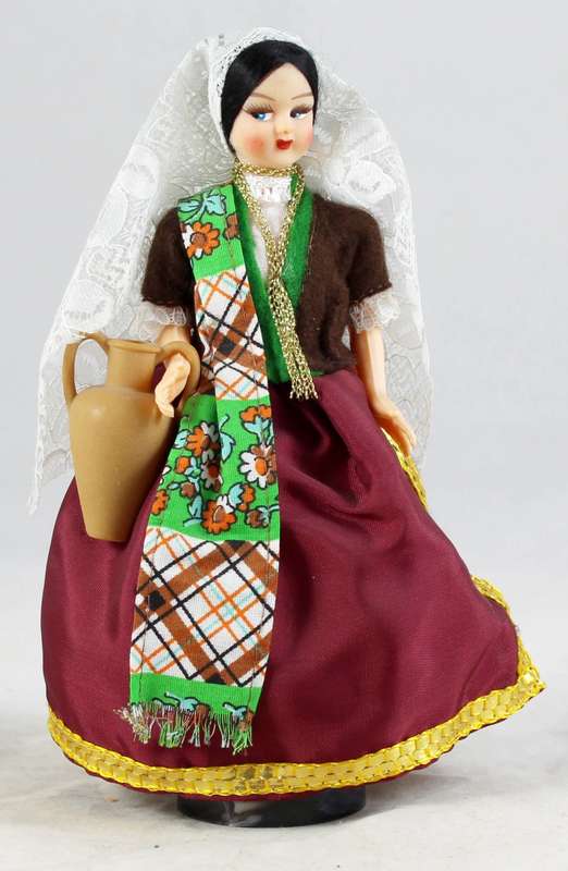 Girl doll carrying an urn in traditional clothes