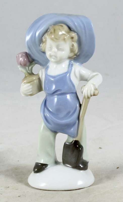 Boy Holding Flower and Spade