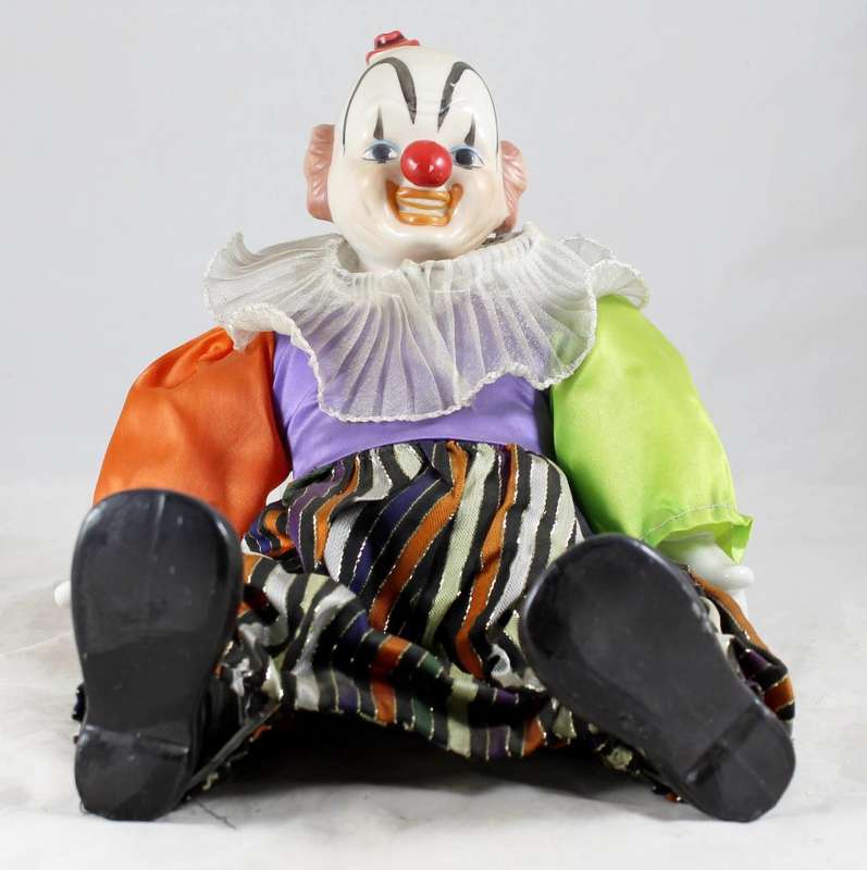 Large laughing clown with striped pants