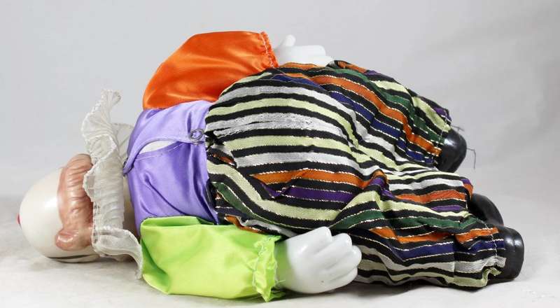 Large laughing clown with striped pants
