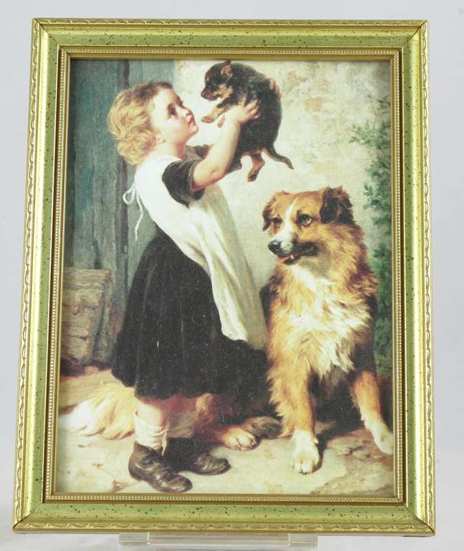 Framed print of little girl holding puppy