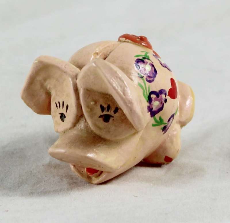 Pink pig with heart and purple flowers