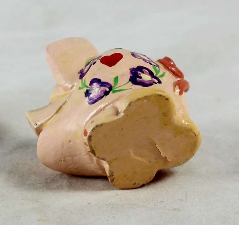 Pink pig with heart and purple flowers