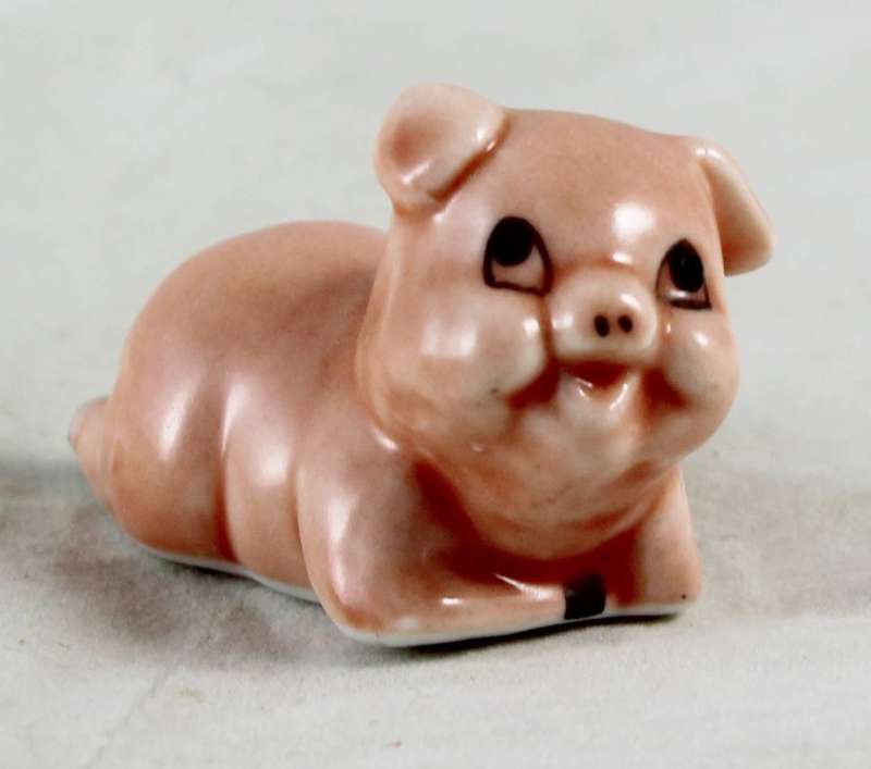 Pink pig laying down