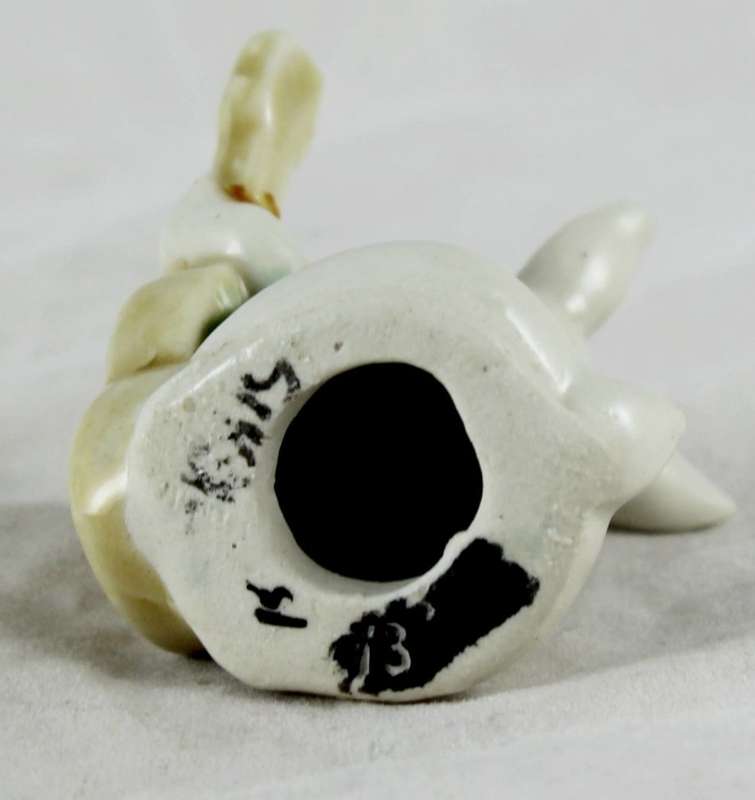 Little white rabbit playing guitar