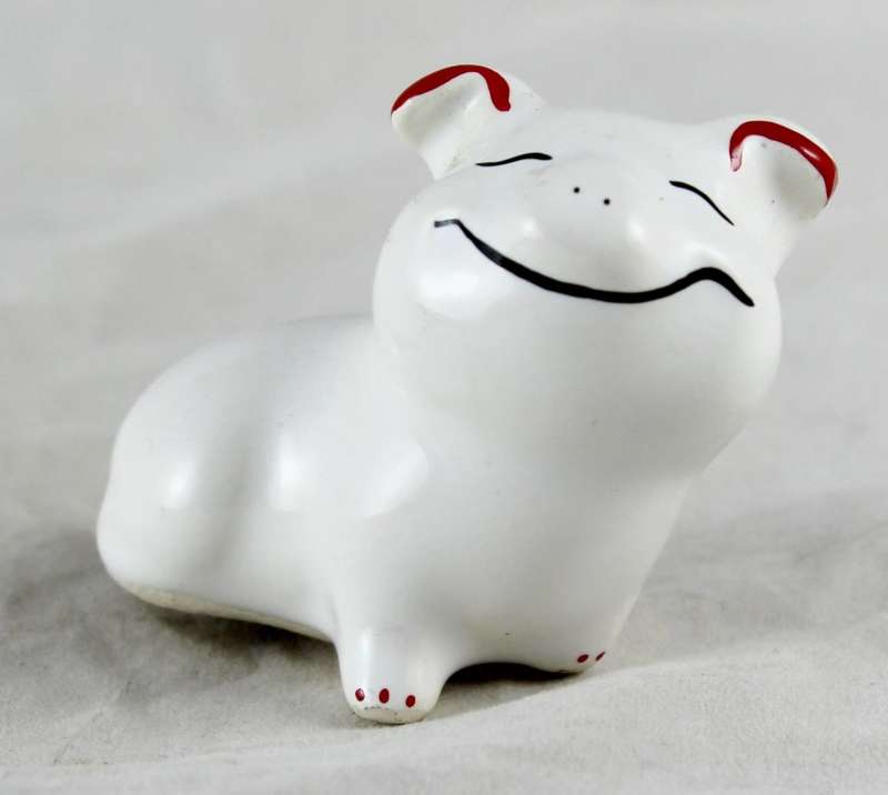 Wide smiling pig with red ears