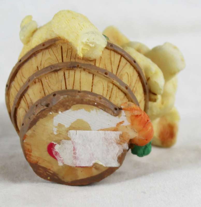 Small pig on carrot barrel