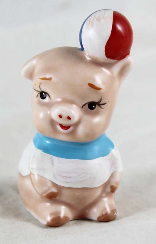 Little pig with beach ball on head