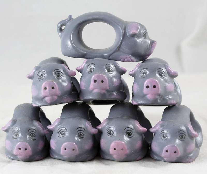 Grey pig serviette holders - set of eight