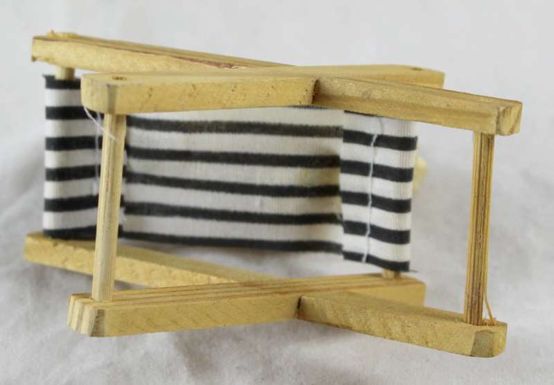 Pig with a book - relaxing on beach chair
