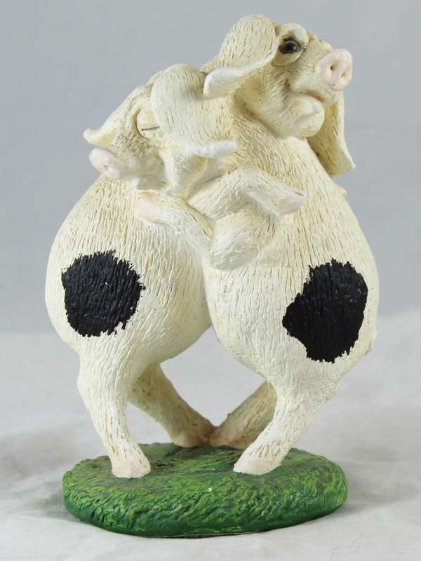 Pair of pigs hugging