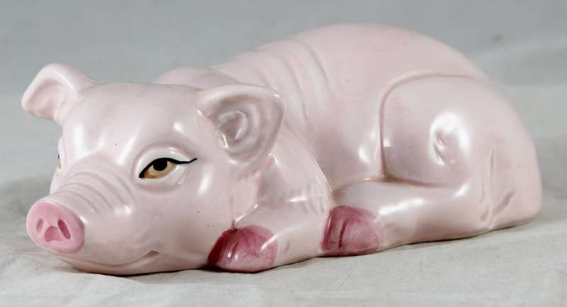 Pink pig laying down