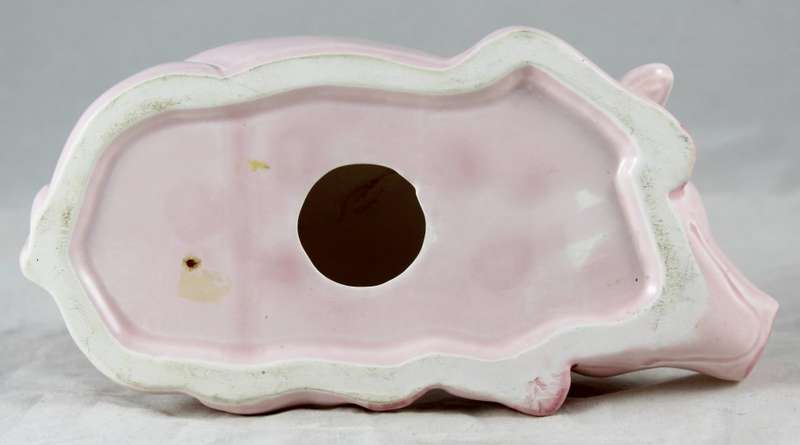 Pink pig laying down