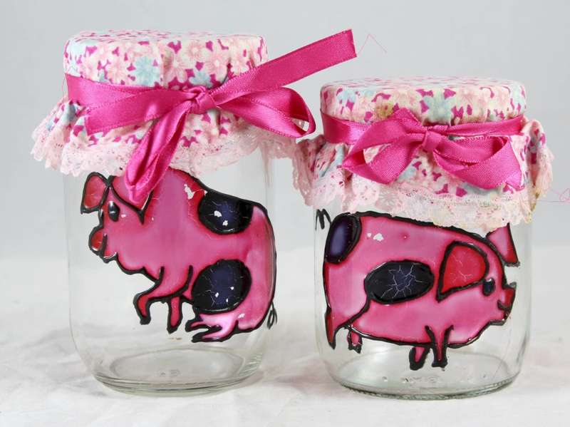 Pair of glass pig painted jars