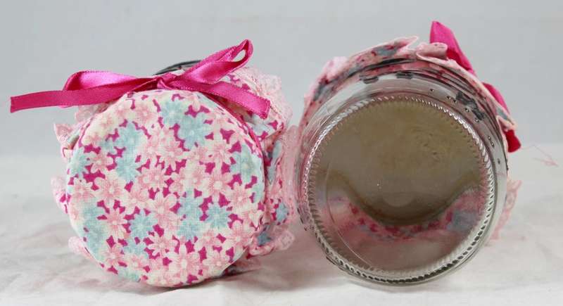Pair of glass pig painted jars