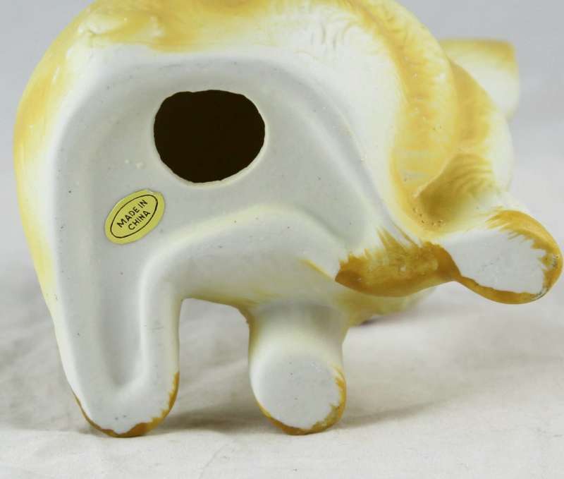 Yellow pig with red & white bow