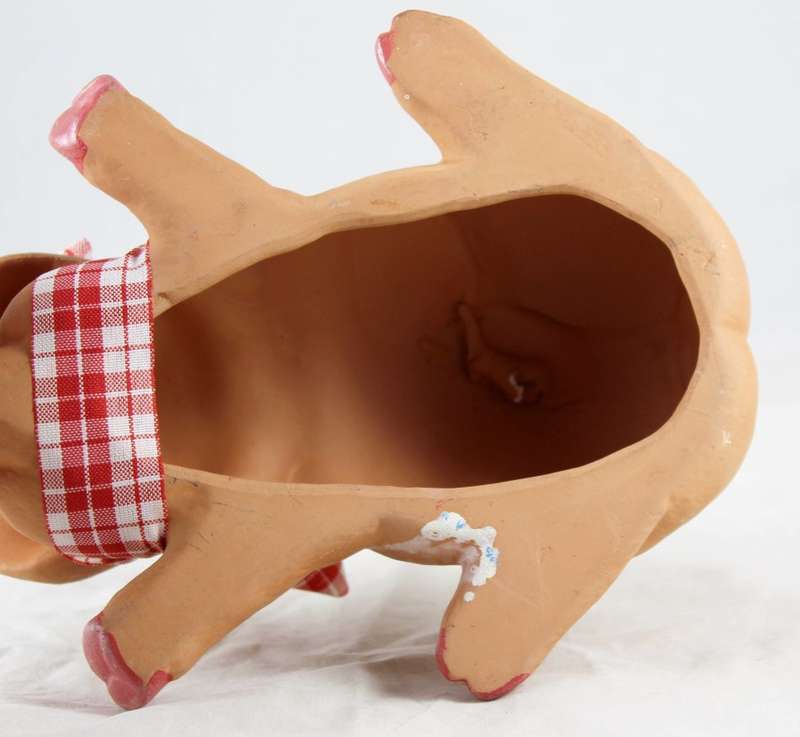 Sleeping pig with red & white bow