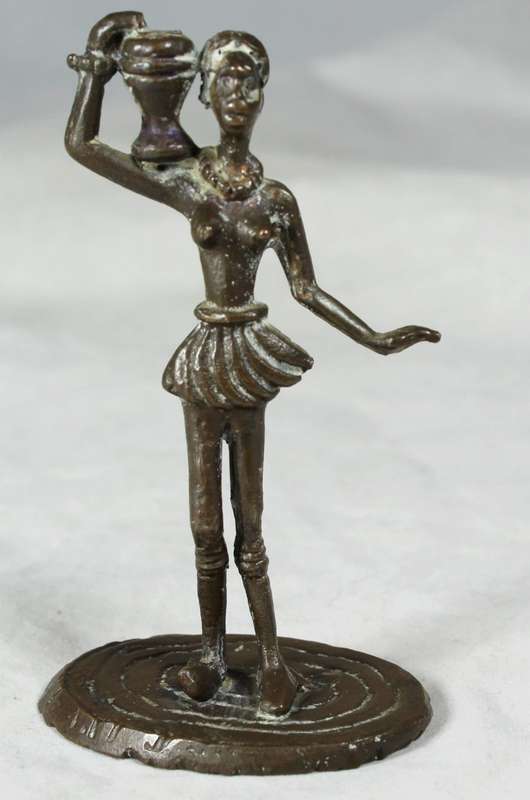 Miniature metal figurine of lady carrying vessel