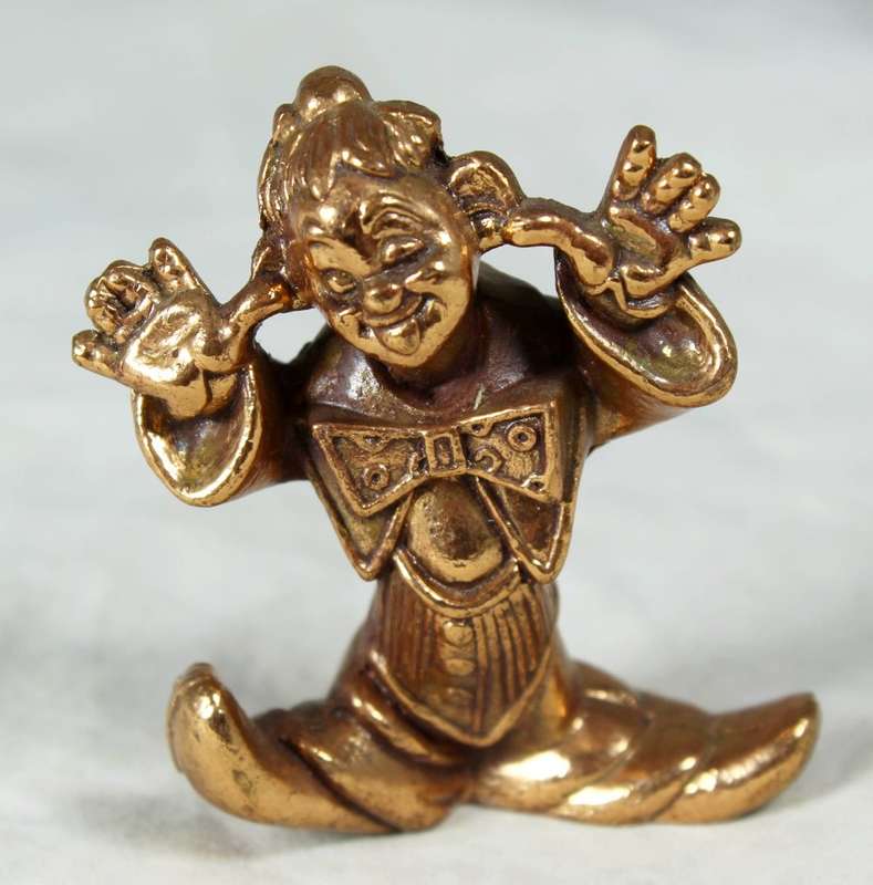 Golden lead figurine - funny face clown