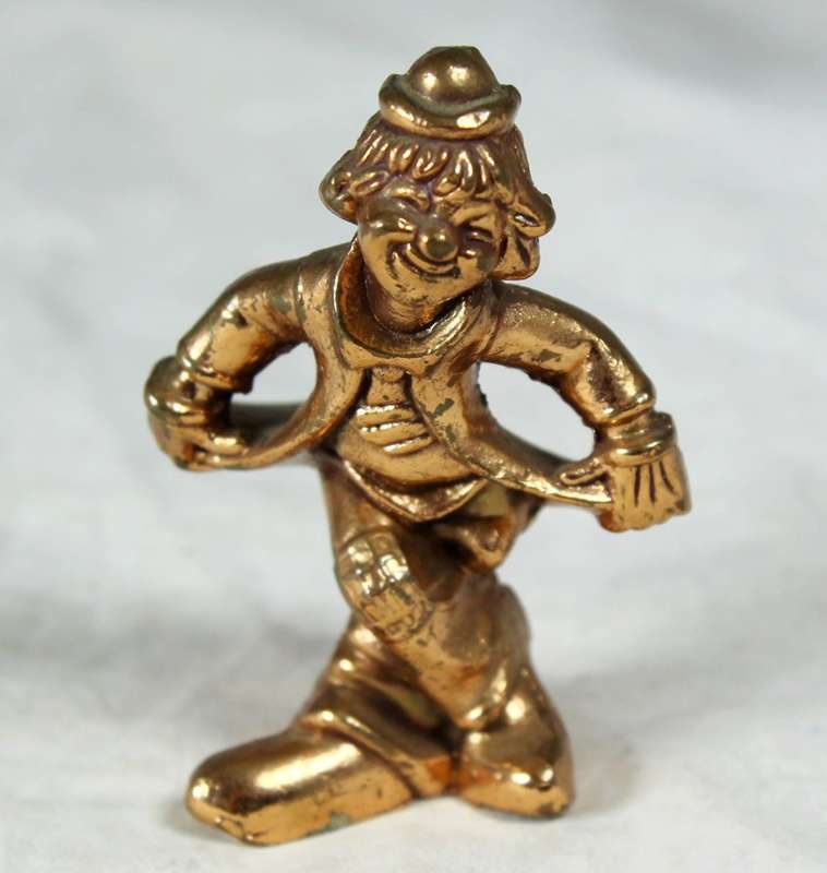 Golden lead figurine - clown doing curtsy