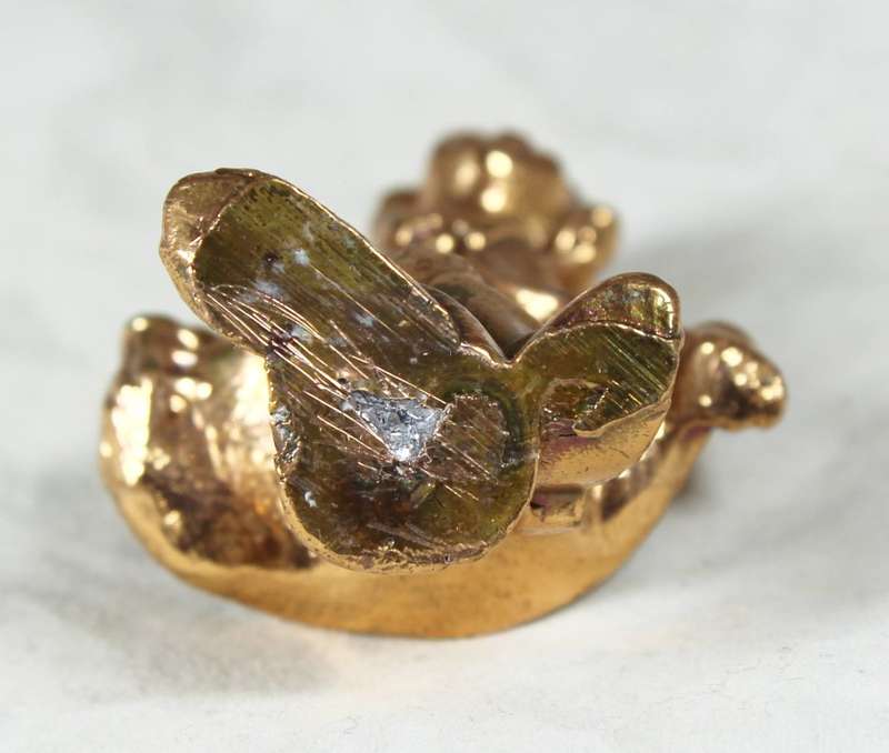 Golden lead figurine - clown doing curtsy