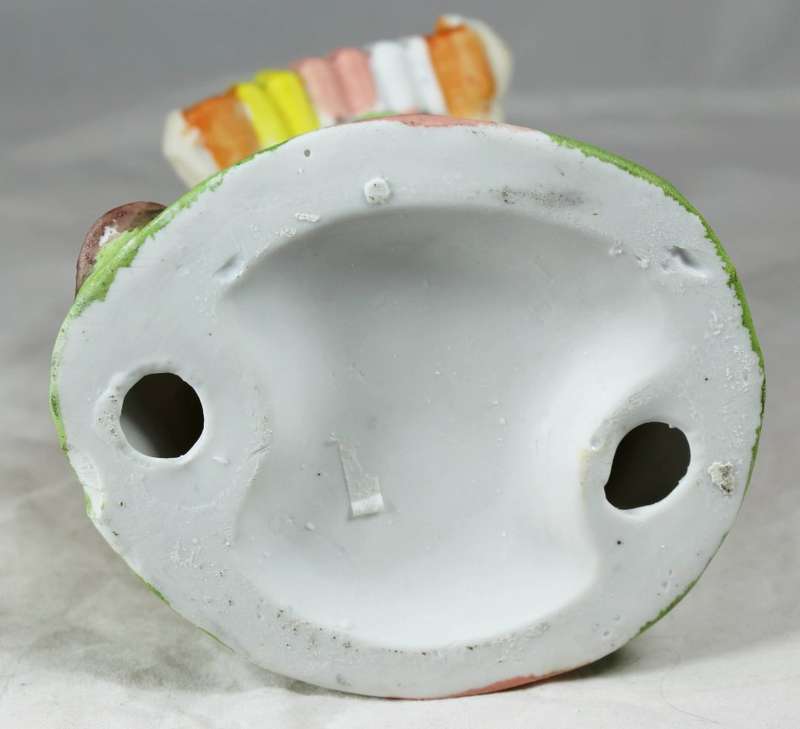 Large clown playing concertina