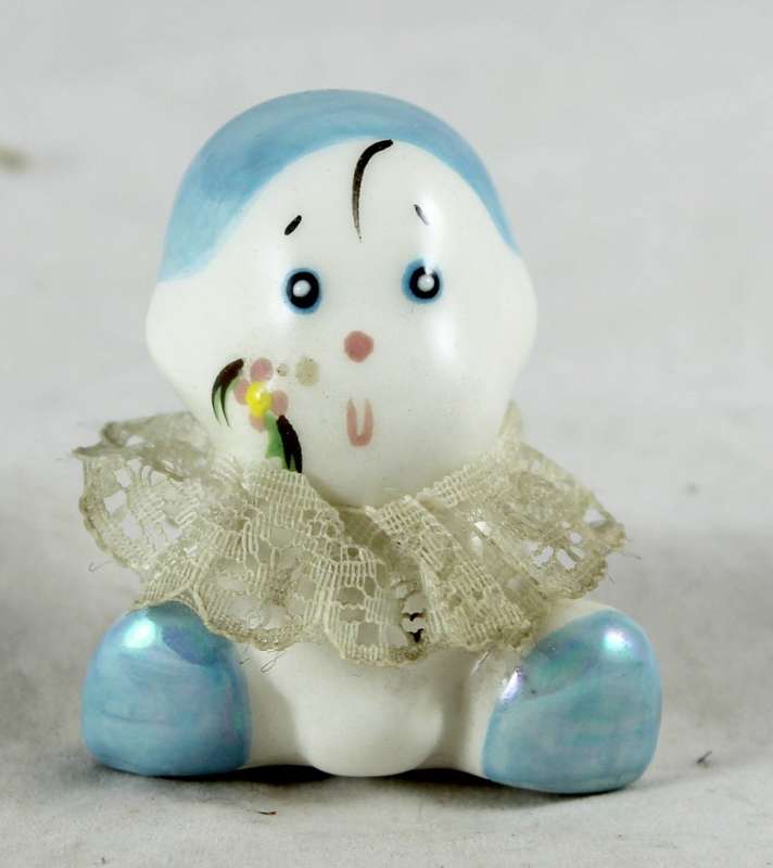 Small porcelain baby with lace collar - light blue head
