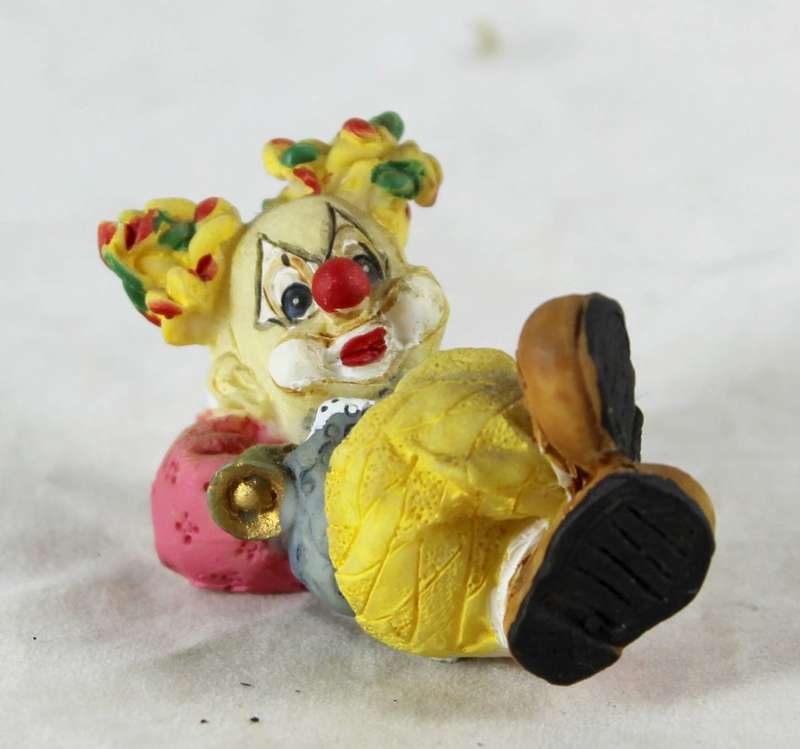 Small clown laying down