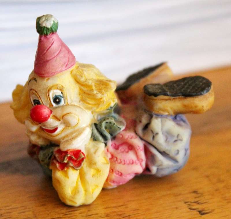 Small clown laying down