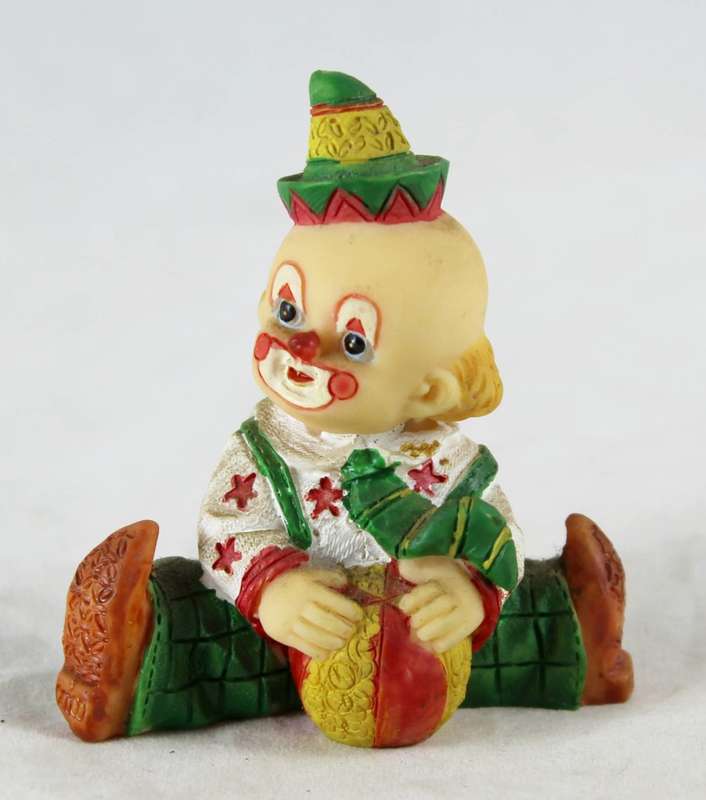 Small baby clown with ball