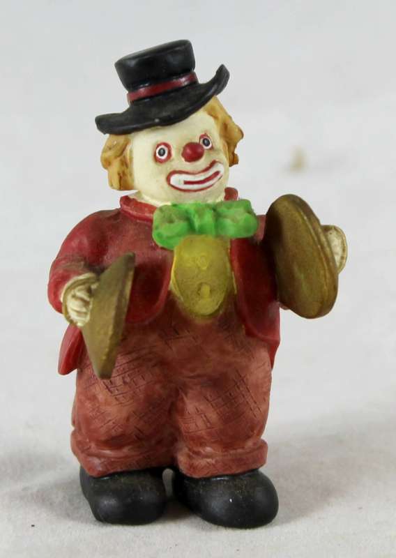 Small clown playing cymbals
