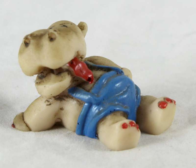 Miniature seated hippo with suspenders