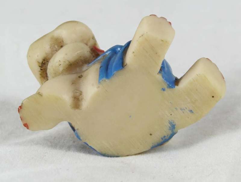 Miniature seated hippo with suspenders